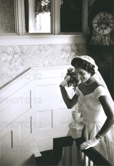 Jackie Bouvier Kennedy Throwing Bouquet, Newport, Rhode Island, USA, by Toni Frissell, September 12, 1953