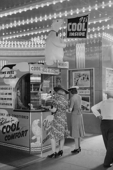 Two Women Buying Tickets at Movie Theater, Chicago, Illinois, USA, John Vachon for Office of War Information, July 1940