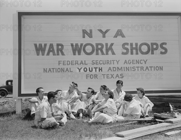 Young National Youth Administration (NYA) Trainees for War Jobs Watching Navy Planes they are Learning to Service at Naval Air Base, Corpus Christi, Texas, USA, Howard R. Hollem for Office of War Information, August 1942