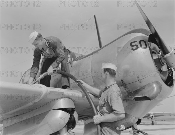 Sailor Mechanics Filling Plane with Gasoline at Naval Air Base, Corpus Christi, USA, Howard R. Hollem for Office of War Information, August 1942