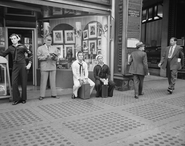 Group of Men and Sailors in Times Square on D-Day, New York City, New York, USA, Howard R. Hollem for Office of War Information, June 6, 1944