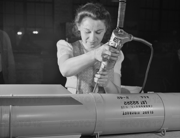 Female Factory Worker, Assembling Flare Casings in Support of War Effort, A.C. Gilbert Company, New Haven, Connecticut, USA, Howard R. Hollem for Office of War Information, February 1942