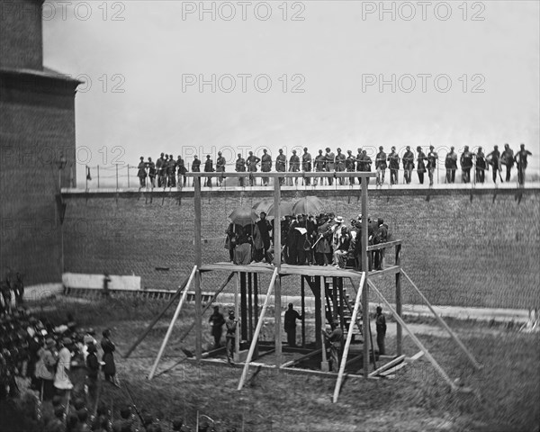 General John F. Hartranft on Scaffold Reading Death Warrant to Conspirators of Assassination of U.S. President Abraham Lincoln, Arsenal Prison, Washington, DC, USA, by Alexander Gardner, July 7, 1865