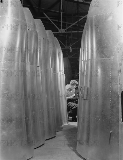 Female Worker Assembling Tail Parts of B-17F Bomber during World War II, Seattle, Washington, USA, Andreas Feininger for Office of War Information, December 1942