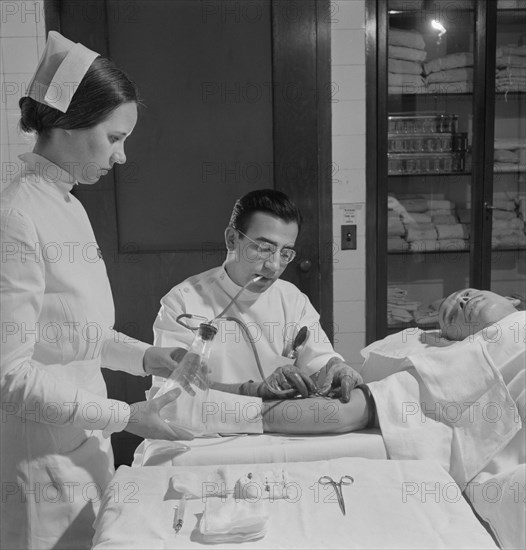 Nurse Assisting Doctor with Blood Transfusion, Fritz Henle for Office of War Information, November 1942