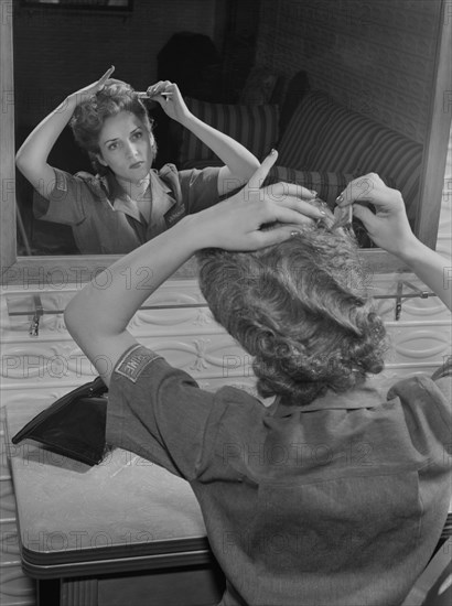 Female Worker Styling her Short Hair for Safe Industrial Work during World War II, Bendix Aviation Plant, Brooklyn, New York, USA, Ann Rosener for Office of War Information, March 1943