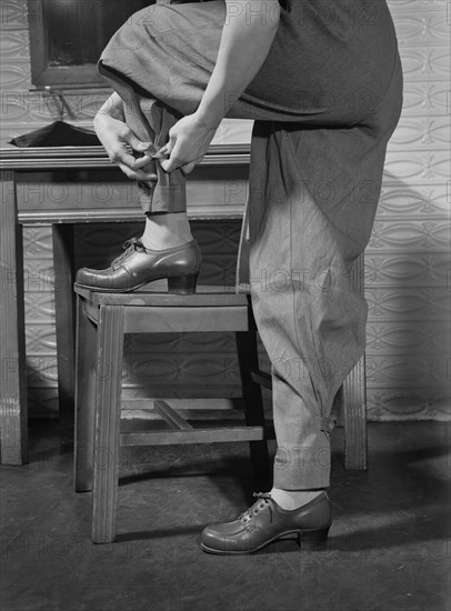 Female War Worker's Factory Uniform includes Safety Features such as Tight-Buttoning Trouser Ankles, Bendix Aviation Plant, Brooklyn, New York, USA, Ann Rosener for Office of War Information, March 1943