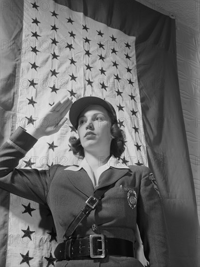 Female Guard Saluting Before Company Service Flag during World War II, Bendix Aviation Plant, Brooklyn, New York, USA, Ann Rosener for Office of War Information, March 1943
