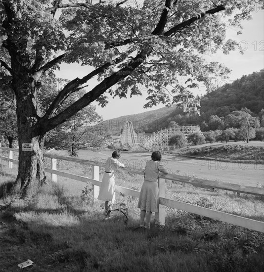 Two Women Viewing Amusement Park from Across Field, Southington, Connecticut, USA, Fenno Jacobs for Office of War Information, May 1942