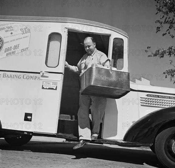 Charles Schneider Baking Company Delivery Truck Displaying a United States Truck Conservation Corps Pledge, Delivery Man Delivering Basket of Bread, Washington DC, USA, Howard Liberman for Office of War Information, October 1942