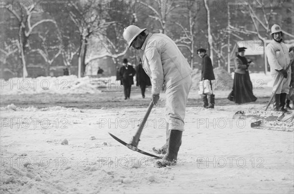Man Clearing Snow from Street with Pickaxe, New York City, New York, USA, Bain News Service, January 1908