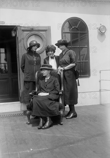 Physicist Marie Curie (seated) with her daughters Irene and Eve, and Mrs. William B. Maloney (center), on RMS OIympic, Arriving in New York City, New York, USA, to Raise Funds for Radium Research, Bain News Service, 1921
