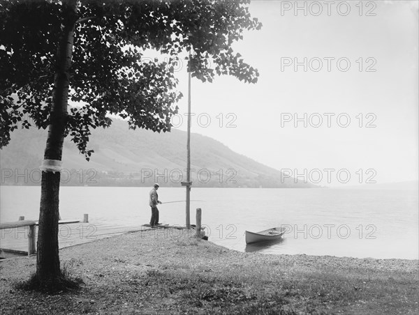 Man Fishing on Dock, Lake Skaneateles, New York, USA, Detroit Publishing Company, 1900