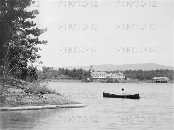 Man in Canoe with Saranac Inn in Background, Upper Saranac Lake, New York, USA, William Henry Jackson for Detroit Publishing Company, 1902