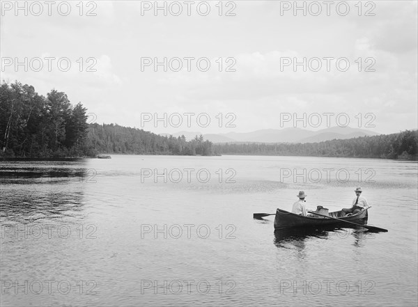Two Men in Canoe on Lake, Adirondack Mountains, New York, USA, William Henry Jackson for Detroit Publishing Company, 1902