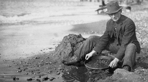 Man Panning Gold on Beach, Nome, Alaska, 1910