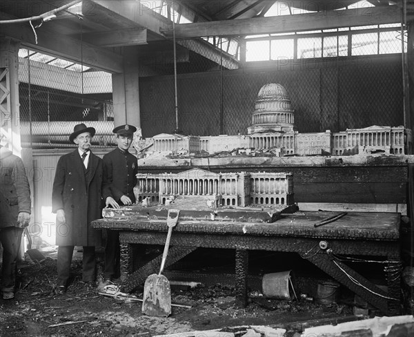 Police Officer with Two Unidentified Men Standing near Charred Model of U.S. Capitol Building after Fire at Capitol Building, Washington DC, USA, Harris & Ewing, January 1930