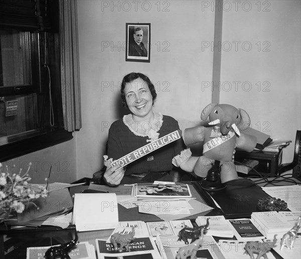 Woman at Office Desk Holding "Vote Republican" Sign and GOP Elephant, Harris and Ewing, 1936