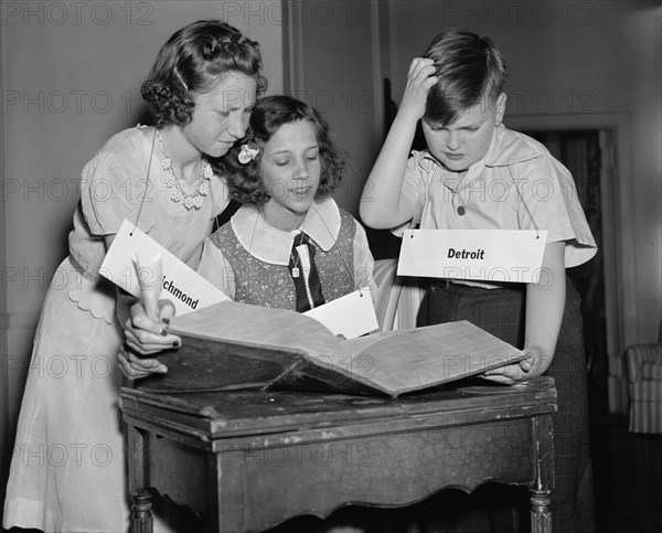 Three Children Studying Words during 16th National Spelling Bee Competition Sponsored by Louisville Courier-Journal, Washington DC, USA, Harris & Ewing, May 1940