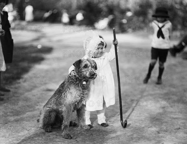 Young Girl with Dog in Park, Harris & Ewing, 1920