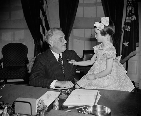 U.S. President Franklin Roosevelt being Presented with First Buddy Poppy of Annual National Poppy Sale by 6-year-old Jane Colgan, with Sales Devoted to Welfare and Relief Work for Veterans and their Families, White House, Washington DC, USA, Harris & Ewing, April 14, 1938