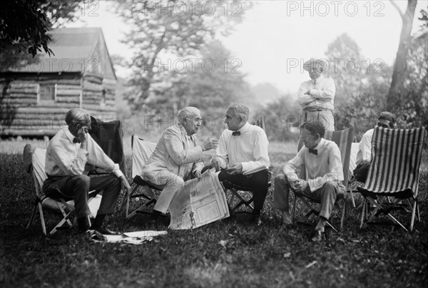 Henry Ford, Thomas Edison, U.S. President Warren Harding and Harvey Firestone, Portrait while Sitting at Campsite, Maryland, USA, Harris & Ewing, 1921