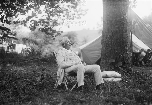 Thomas Edison, Seated Portrait while Smoking Cigar at Campsite, Maryland, USA, Harris & Ewing, 1921