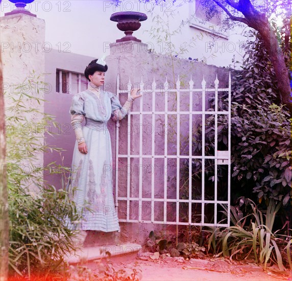 Woman in Formal Dress Standing at Gate Entrance, Italy, Prokudin-Gorskii Collection, 1910