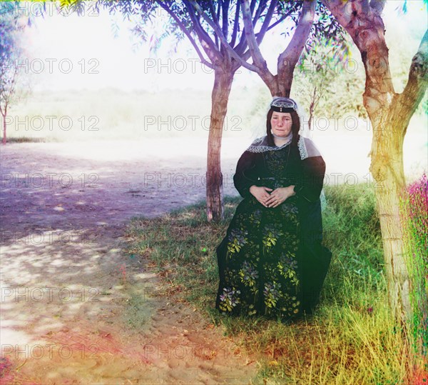 Portrait of Georgian Woman in Folk Costume Sitting under Shade Tree, Mugan Steppe, Azerbaijan, Russian Empire, Prokudin-Gorskii Collection, 1910