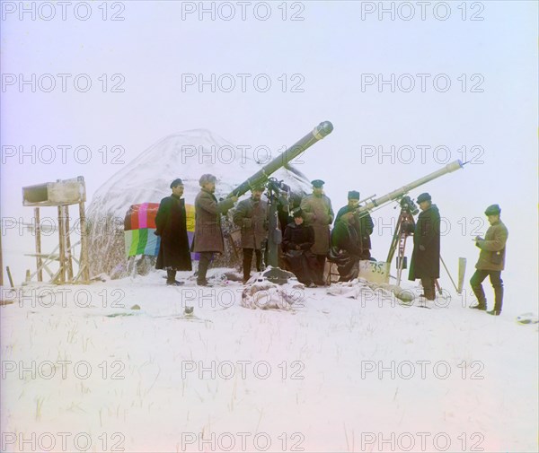 Group of People Using Two Telescopes to View Solar Eclipse on Snow-Covered Mountain, near Cherniaevo Station, Tian-Shan Mountains above Saliuktin Mines, Golodnaia Steppe, Kazakhstan, Russian Empire, Prokudin-Gorskii Collection, January 1, 1907