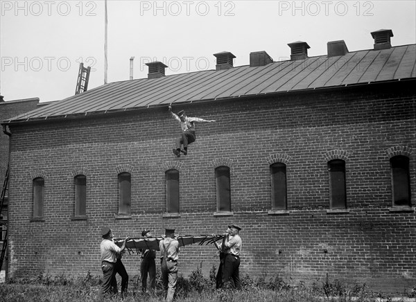 Fireman Jumping from Building Rooftop, Firemen's School, Washington DC, USA, Harris & Ewing, 1921
