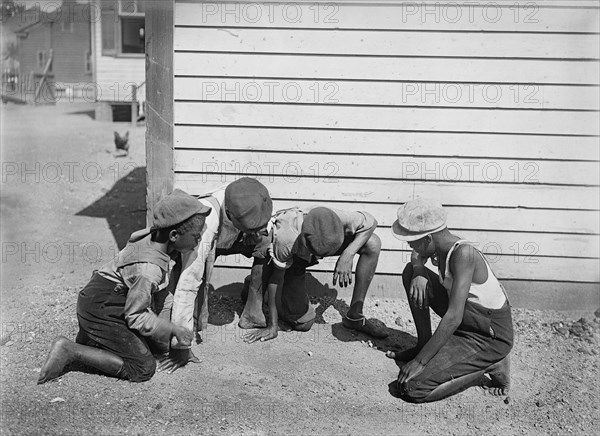 Group of Young Boys Playing Game of Dice on Side of Building, Detroit Publishing Company, 1901