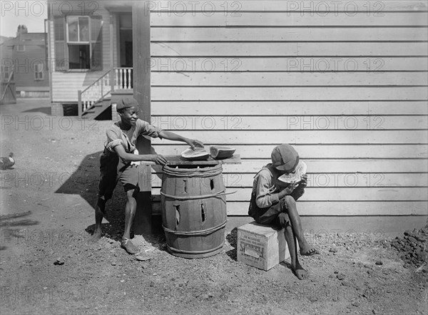 Two Young Boys Eating Watermelon on Side of House, Detroit Publishing Company, 1901