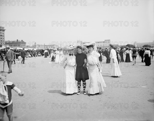 Portrait of Three Young Women Amongst Crowd at Beach, Atlantic City, New Jersey, USA, Detroit Publishing Company, 1905