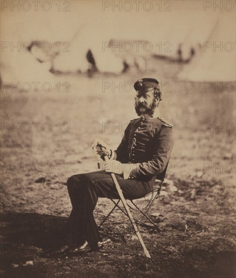 British Major Percy Archer Butler, Seated Portrait in Uniform and Holding Sword with Military Tents in Background, Crimean War, Crimea, Ukraine, by Roger Fenton, 1855