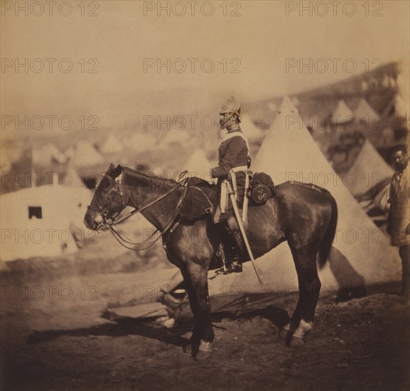 British Major Adolphus Burton, 5th Dragoon Guards, Seated Portrait in Uniform on Horse, Conical Military Tents in Background, Crimean War, Crimea, Ukraine, by Roger Fenton, 1855