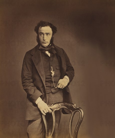 British Lieutenant-Colonel John Clarke Kennedy, 18th (Royal Irish) Regiment of Foot, Three-Quarter Length Portrait in Suit Standing Behind Chair, Crimean War, Crimea, Ukraine, by Roger Fenton, 1855