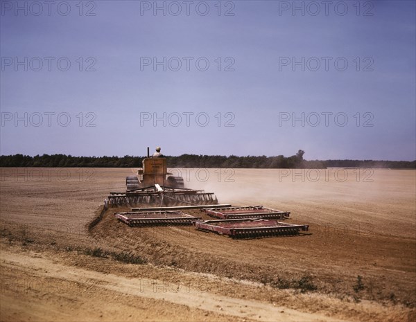 Harrowing a Field with Diesel Tractor, Seabrook Farm, Bridgeton, New Jersey, USA, John Collier for Farm Security Administration - Office of War Information, June 1942