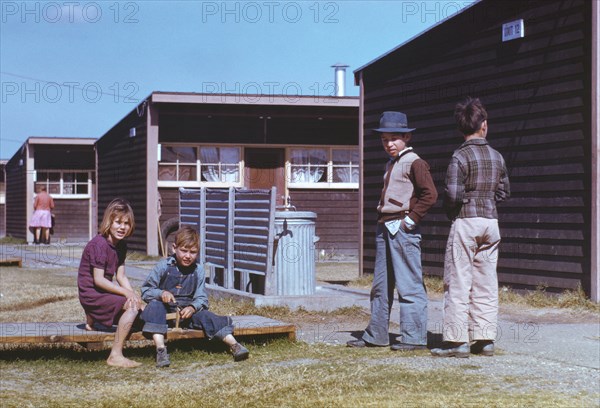 Boy Building Model Airplane while other Children Look on, Farm Security Administration (FSA) Labor Camp, Robstown, Texas, USA, Arthur Rothstein for Farm Security Administration - Office of War Information, January 1942