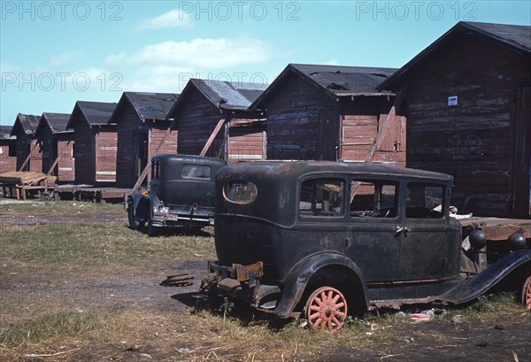 Row of Homes Condemned by Board of Health that are Still Occupied by African-American Migratory Workers, Belle Glade, Florida, USA, Marion Post Wolcott for Farm Security Administration, January 1941