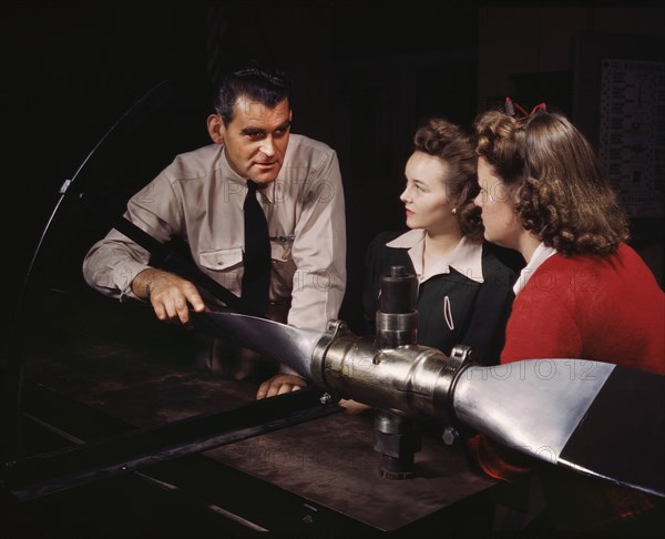 Instructor Ralph Angar Explaining Propeller Characteristics to Two Students in Aeronautics Class, while Training Students for Specific Contributions to the War Effort, Washington High School, Los Angeles, California, USA, Alfred T. Palmer for Office of War Information, September 1942