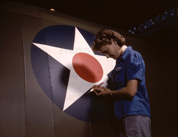 Female Worker Touching up U.S. Army Air Force's Insignia on Side of Fuselage of "Vengeance" Dive Bomber Manufactured at Vultee's Nashville Division, Tennessee, USA, Alfred T. Palmer for Office of War Information, February 1943