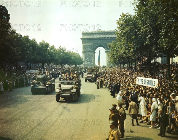 Crowds of French Patriots line Champs Elysees to view Allied Tanks and half tracks pass through the Arc du Triomphe after Paris, France was Liberated on August 25, 1944, Jack Downey, Office of War Information, August 26, 1944