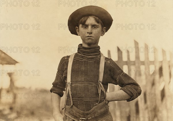 John Lewis, 12 years old, Weaver in Cotton Mill, Half-Length Portrait, Chester, South Carolina, USA, Lewis Hine for National Child Labor Committee, November 1908