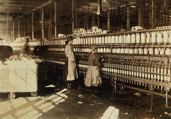 Two Young Spinners, Full-Length Portrait in Spinning Room at Cotton Mill, Newberry, South Carolina, USA, Lewis Hine for National Child Labor Committee, December 1908