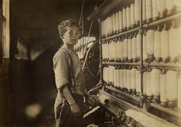 John Dempsey, 11 or 12 years old, Worker in Mule-Spinning Room, Jackson Mill, Fiskeville, Rhode Island, USA, Lewis Hine for National Child Labor Committee, April 1909