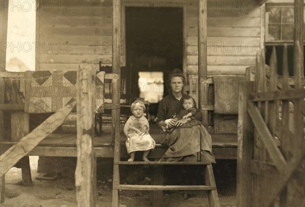 Wife and Children of Mill Worker, Portrait on Porch Steps of Home in Rundown Cotton Mill Village, Matoaca, Virginia, USA, Lewis Hine for National Child Labor Committee, June 1911