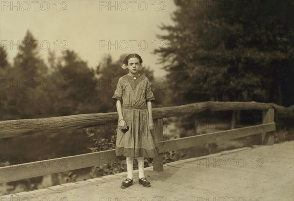 Rosina Goyette, 12 years old, but said she is 14, Full-Length Portrait, Works as Doffer and Spinner at Spring Village Mills, Winchendon, Massachusetts, USA. Lewis Hine for National Child Labor Committee, September 1911
