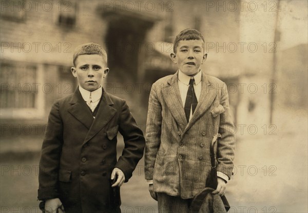 Michael Keefe, Cornelius Hurley, 13 or 14 years old, Young Mill Workers in No. 1 Mill Room, Merrimac Mill, Lowell, Massachusetts, USA, Lewis Hine for National Child Labor Committee, October 1911