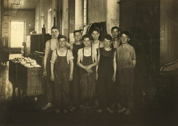 Group of Back Boys in Mule Room, 14 to 16 years old, Full-Length Portrait, King Philip Mills, Fall River, Massachusetts, USA, Lewis Hine for National Child Labor Committee, June 1916